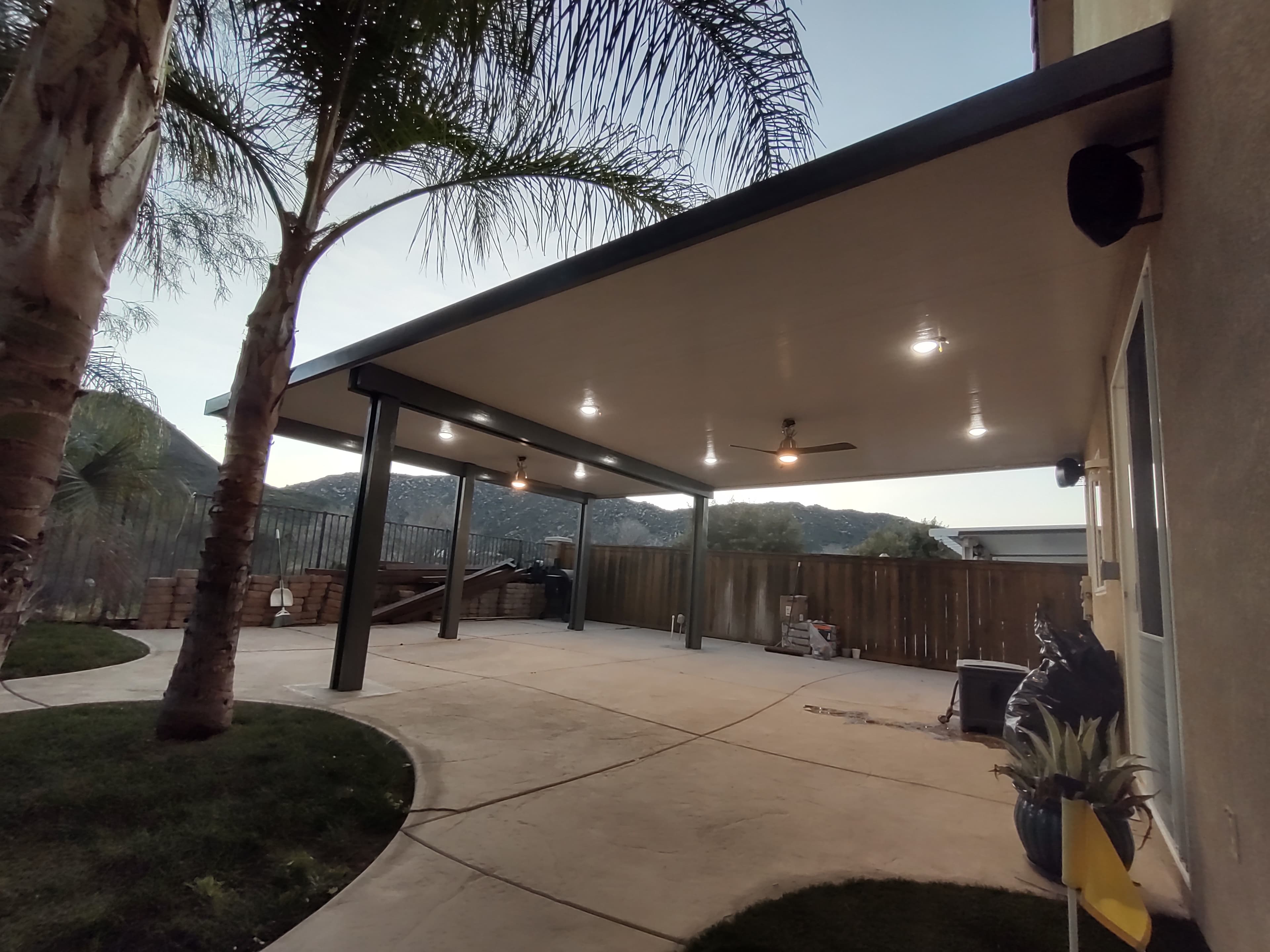 Insulated panel patio cover providing thermal protection