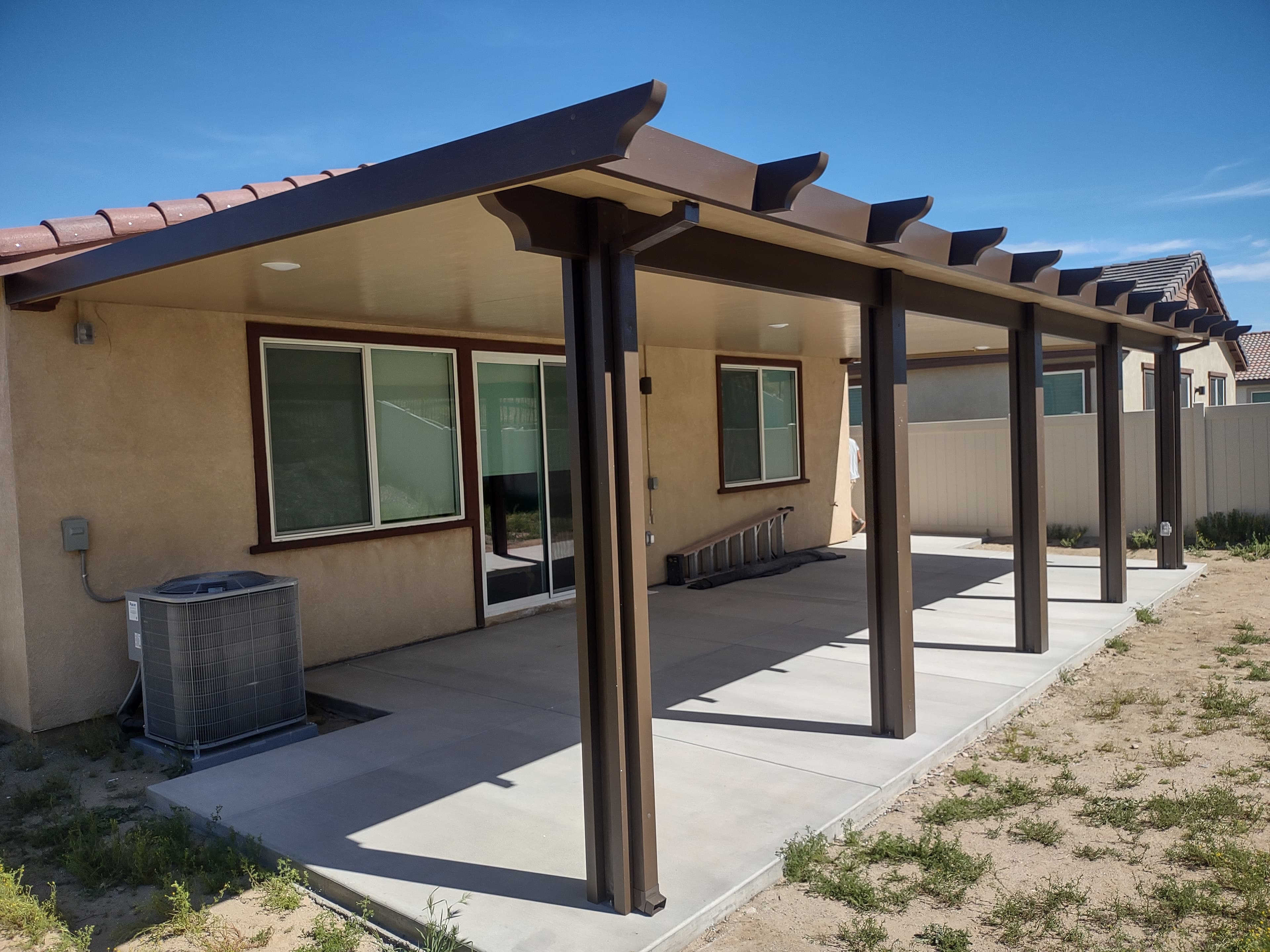 Multi-level aluminum patio cover with mixed solid and lattice sections